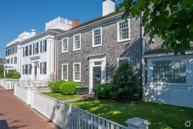 Colonial homes with white picket fences line the streets of Edgertown.