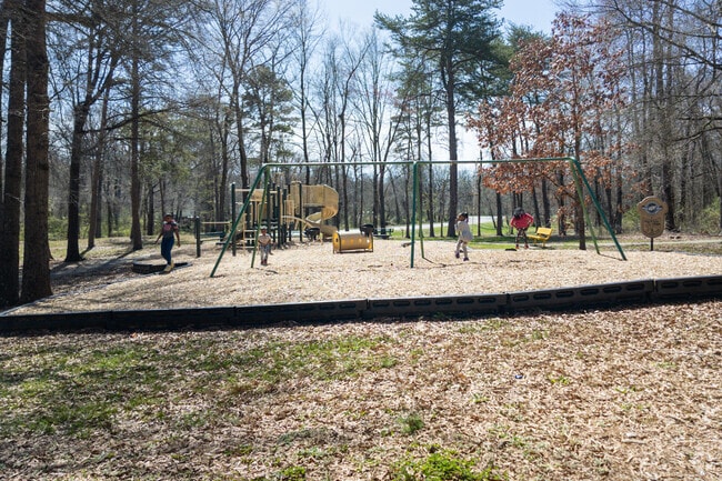 Autumn fun for all: Phillips Ave's kids frolic in Autumn Park.