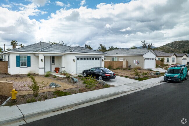 Newly built single-story homes line a quiet residential street in East Hemet.