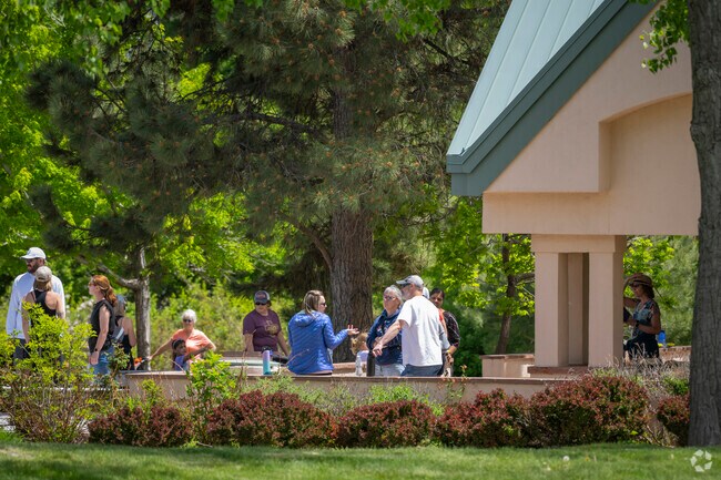 In Governor's Ranch, friends and family gather at a local park on a sunny day.