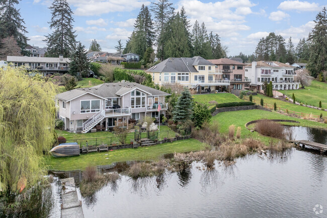 Wake up to the sound of nature's symphony in a Lake Stickney waterfront home.