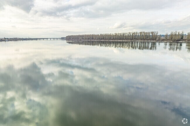 Clouds reflect on the sprawling Columbia River in Argay.