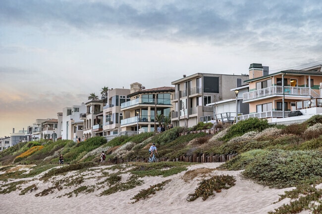 Manhattan Beach is lined with a row of luxury homes looking directly at the Pacific Ocean.