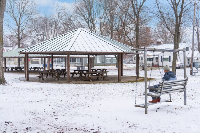 Washington Park has a bench swing by the entrance of the park.