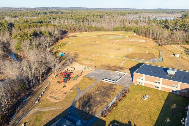 The school's facilities include modern classrooms and sports fields for students.