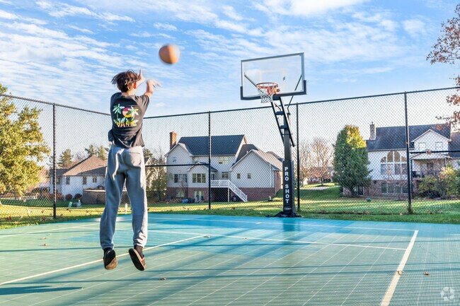 A boy shoots hoops on the court at Monticello Park in the Washington Square neighborhood.