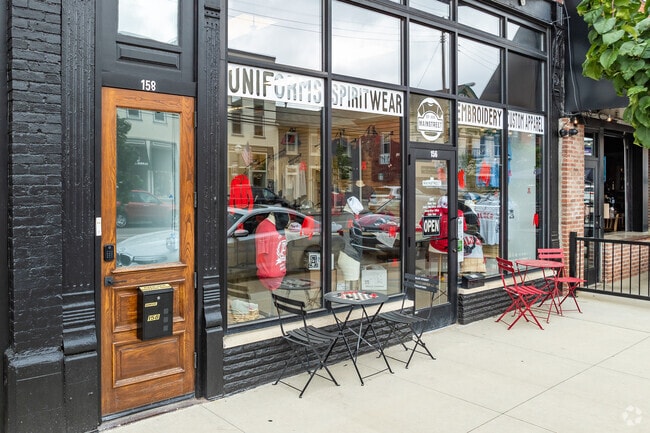 Local storefronts line Main Street of Plain City, Ohio, including massage therapists, dental services and barbers.