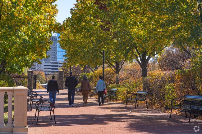 Stroll and enjoy lush foliage along paved trails in Cool Spring Park.
