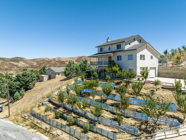This home sits on a large property on top of a hill in Elizabeth Lake.