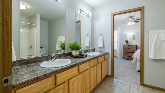 Experience luxury in our shared and private bathrooms in your 4-bedroom townhome. Enjoy generous countertops, ample storage, and a stylish design for your daily pampering rituals.