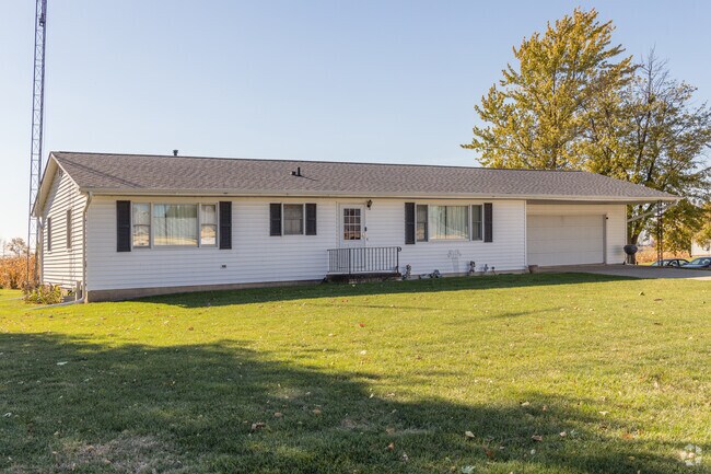A classic ranch-style home with an attached garage in Somonauk.