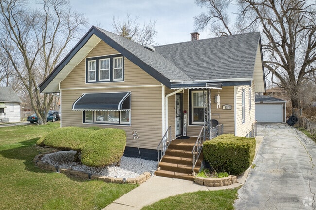 One of many charming homes nested in the quaint Phoenix, IL area.