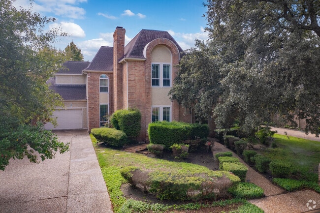 Well-kept lawns and flourishing gardens enhance the beauty of Hilshire Village homes.