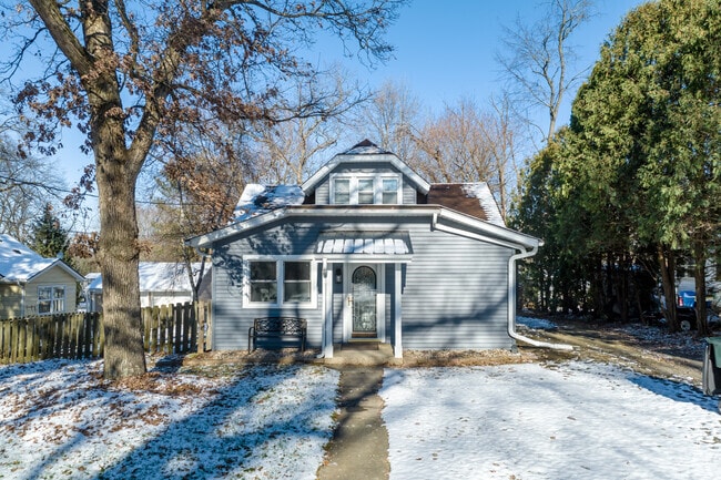 Bungalow style home with grey siding located in Twin Lakes.