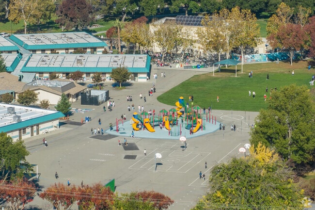 Walnut Grove Elementary School has a large blacktop with play structure.