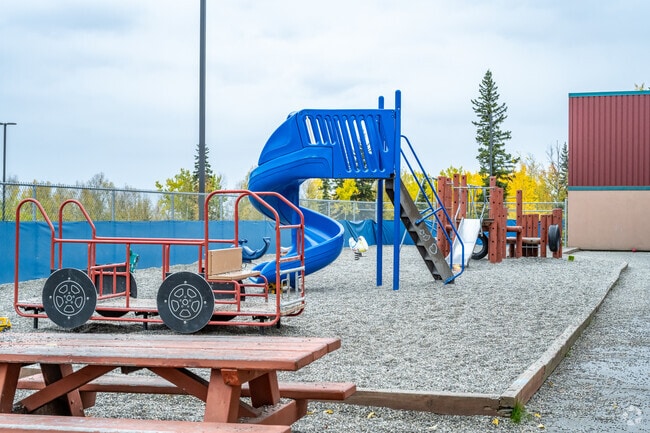 Younger students have fun at the smaller playground at Weller Elementary School.