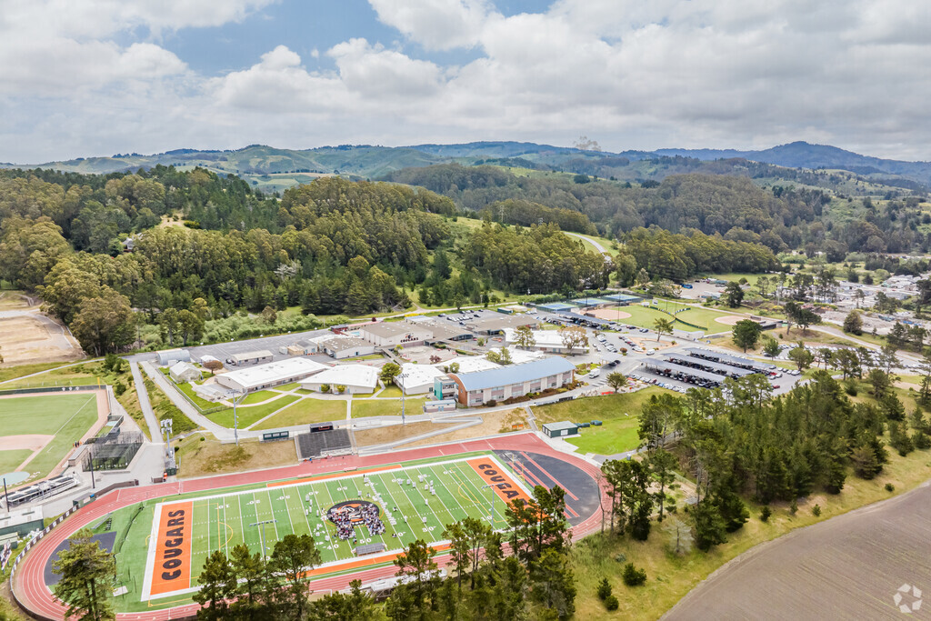 Half Moon Bay High School is next to the hills in the eastern part of town.