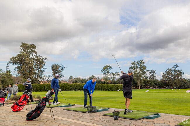 Linfield Oaks golfers enjoy practice swings at Stanford's range.