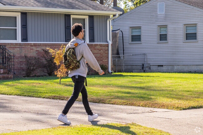 A student on his way to one of the local schools in the Sherwood Forest neighborhood of Norfolk.