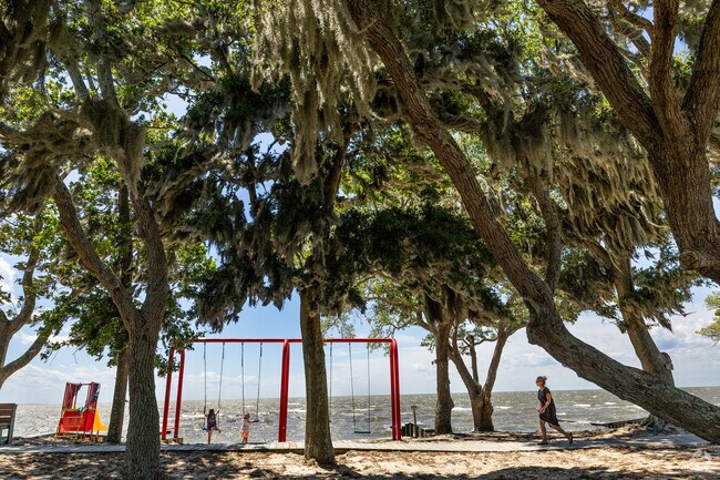 Children swing with a view at Colington Harbour's Soundfront Park in the quiet gated neighborhood.