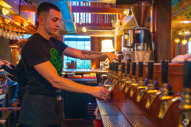 Drinks are served on a bar made of re-milled redwood wine barrels at McMenamins John Barleycorns.