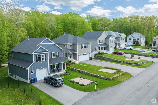 A welcoming row of beautifully maintained homes lines the streets of Lippitt Estates, where charm meets suburban comfort.