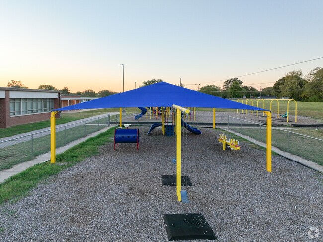 A shelter keeps kids shaded in the summer on this playground in Griffin Gate at Mary Todd