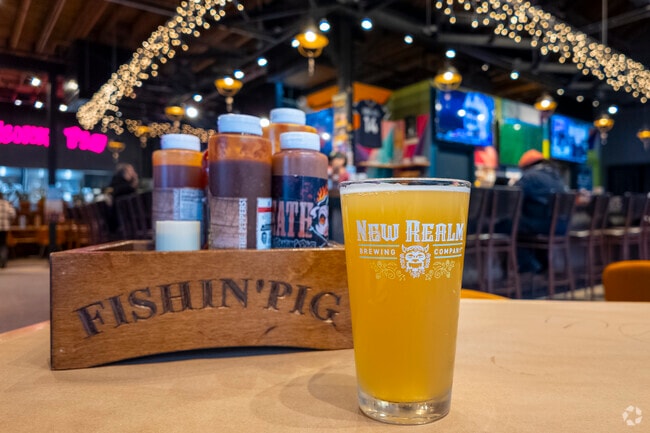 Neighbors love to grab a beer and have some bbq at The Fishin' Pig in Park Place.