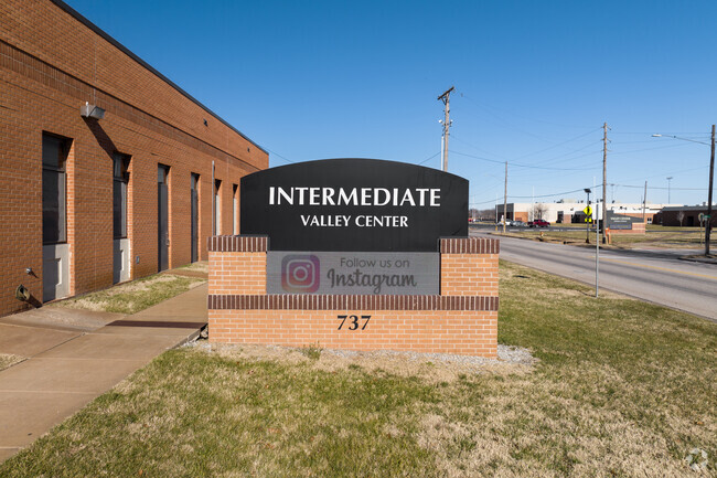 There is a large brick sign near the entry of Valley Center Intermediate School.