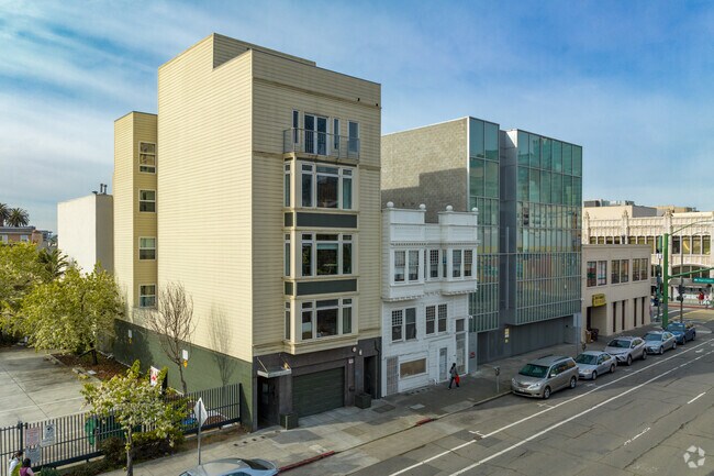 Many condo buildings feature small balconies overlooking the city.