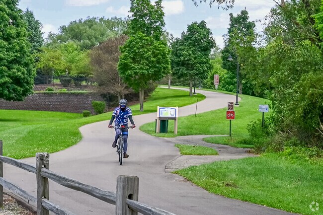 The paved trails of Portage Creek Bicentennial Park is located near Hill N Brook.