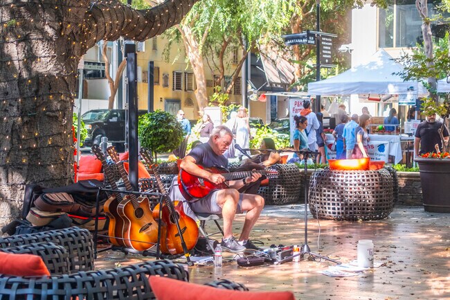 Santana Row brings out local artists to play live music while shoppers walk around.