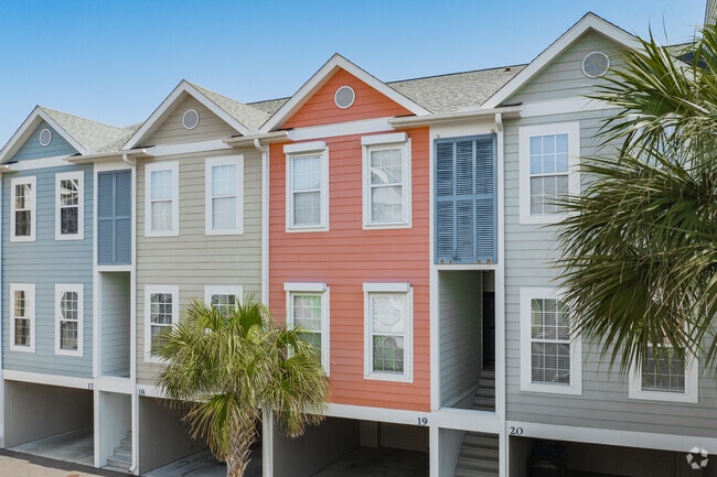 Find colorful townhomes on Folly Beach with walking distance to Center Street and Folly Creek.