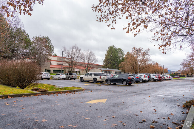 Cooper Elementary features a small parking lot for visitors.