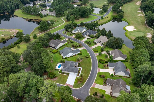 The many water features of around The Crescent mirror the beauty of the marsh to the north.
