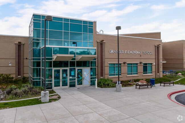 A modern glass entrance welcomes students to Granger Elementary School.