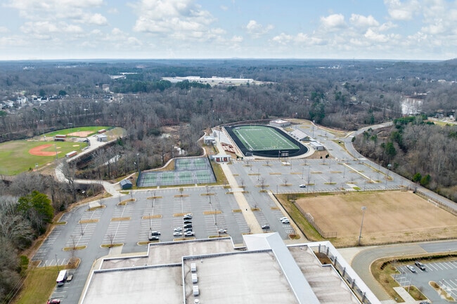 Aerial overview of the athletic complex and fields of Stuart W. Cramer High School.