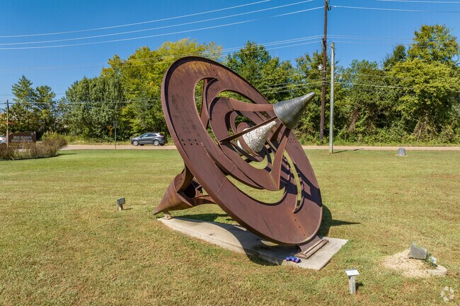 Heritage Park features a large sculpture in the shape of a top.