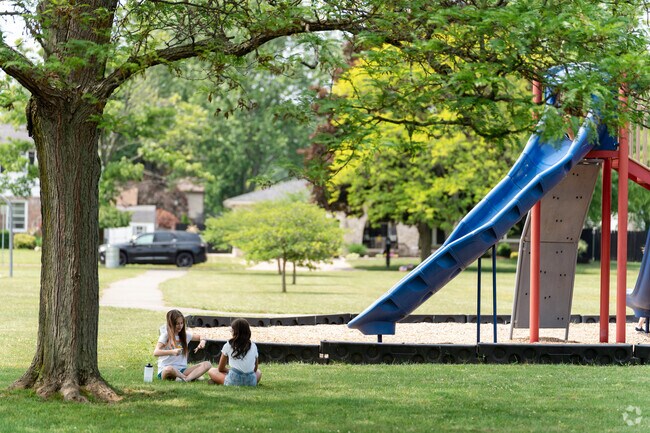 Pendleton residents play and relax at Deerfield Playground in North Amherst.