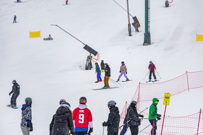 Kids and adults enjoy the slopes at Seven Springs Resort near Middlecreek Township.