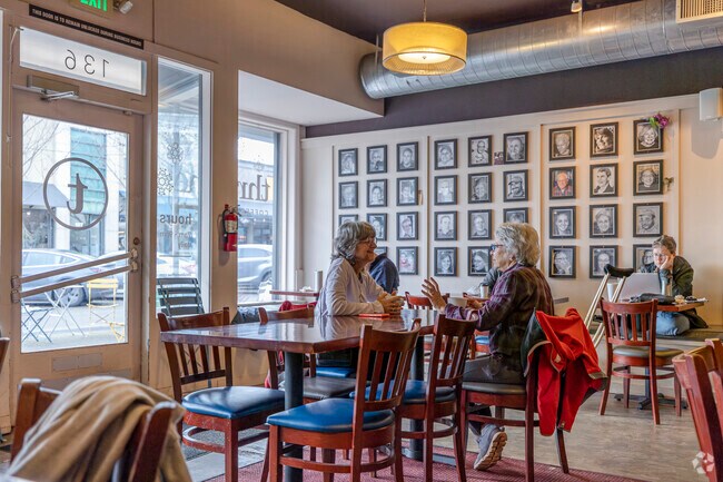 Friends catch up over a cup of coffee at Thruline Coffee Co.