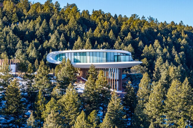 Iconic mountain mansions like this pop out of the trees in Genesee North Central.
