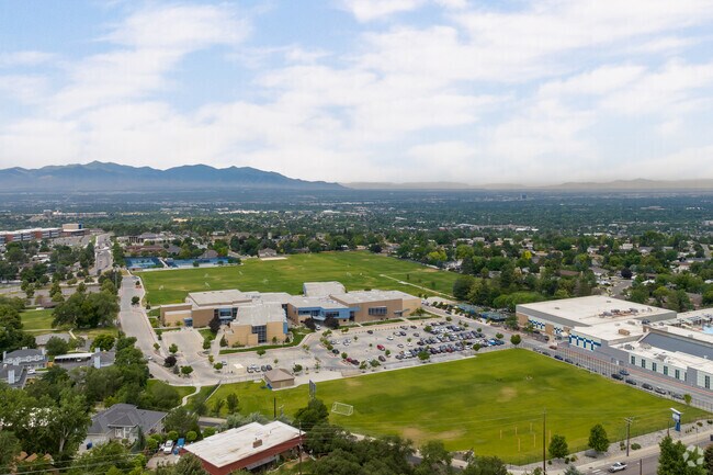Large green sports fields surround Butler Middle School.