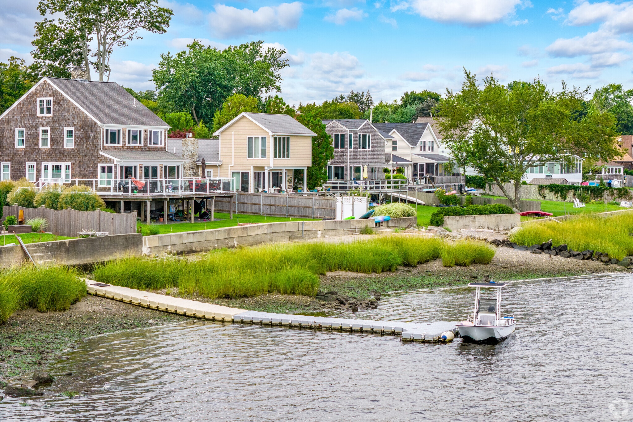 This row of homes in the Massachusetts Touisset neighborhood is along the shore of Cole River.