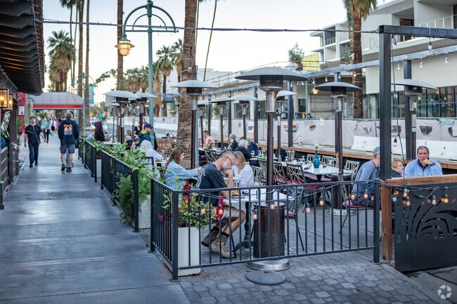 Sit on the patio along S Palm Canyon and enjoy a drink at Tac/Quila near Oasis del Sol.