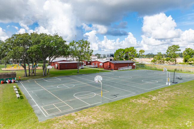 Kids enjoy outdoor play on the sports courts at
 Mary Giella Elementary School.
