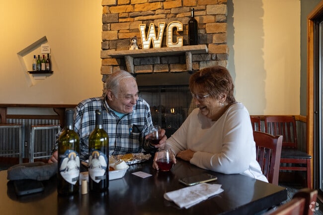 Diners enjoy the flavors and picturesque vineyard backdrop of Wolf Creek Winery near Copley.