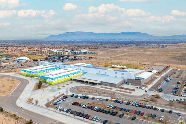 George I Sanchez Collaborative Community School with the Sandia Mountains in the background.