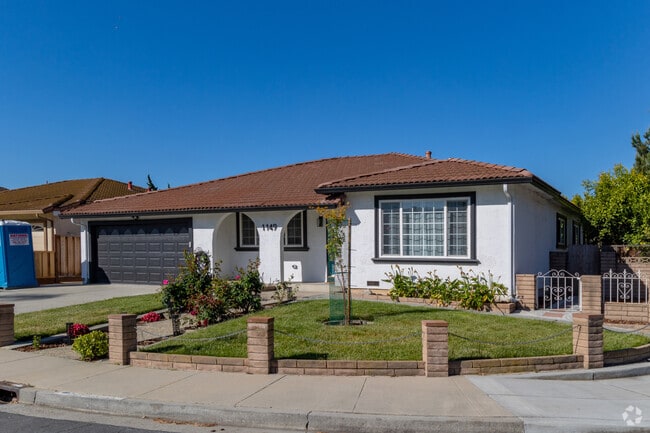 Bungalow-style homes in Penitencia often feature red-tile roofs and arched doorways.