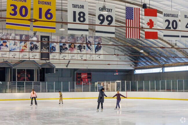 The Iceland Rink in Paramount displays the jerseys of Kings hockey heroes over the ice.